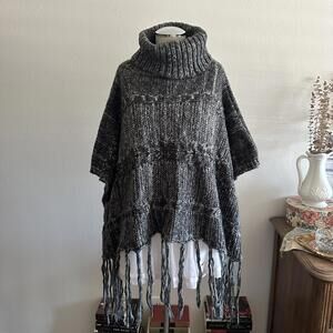 Black and gray knit turtleneck poncho